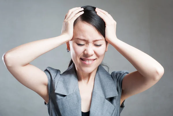 Young woman with head pain on white background — Stock Photo, Image