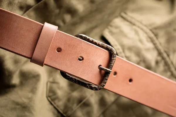 Handcrafted light brown leather strap belt — Stock Photo, Image