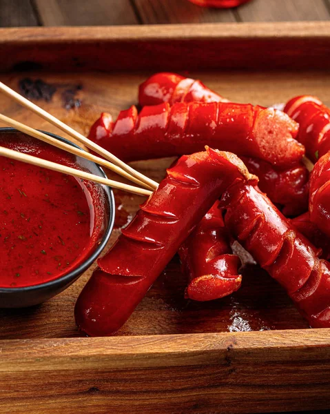 Bar appetizer beer hunting sausages with sauce — Stock Photo, Image