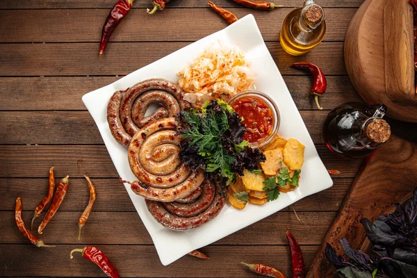 Assorted grilled sausages with sauerkraut — Stock Photo, Image