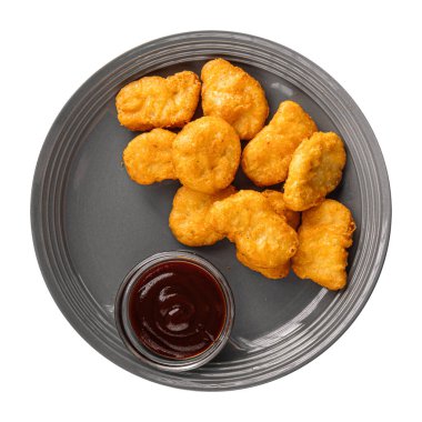 İzole edilmiş soslu tavuk nuggetları.
