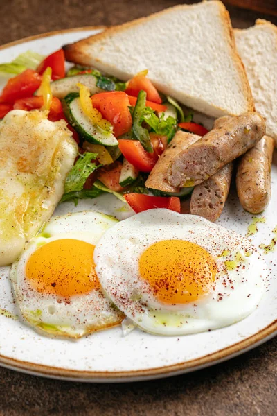 German breakfast with fried eggs and sausages — Stock Photo, Image