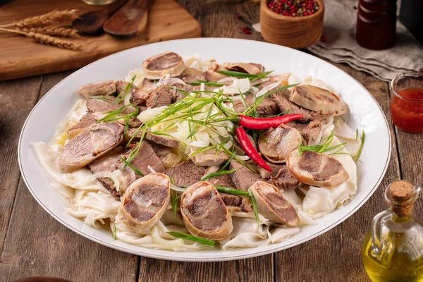 Portion of kazakh dish beshbarmak — Stock Photo, Image