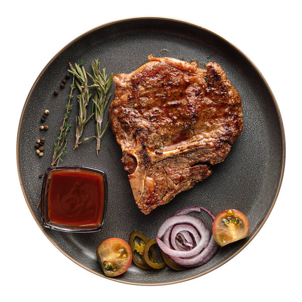 Isolated plate of grilled beef steak bone