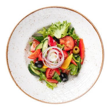 Isolated portion of greek salad with fresh vegetables