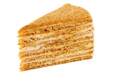 Isolated slice of layered honey cake with sour cream