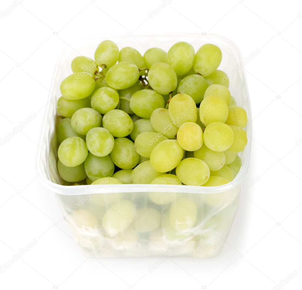 Bunch of ripe and juicy green grapes on a white background