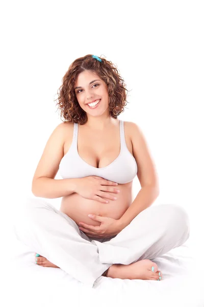 Schöne schwangere Frau zeigt ihre gute Form — Stockfoto