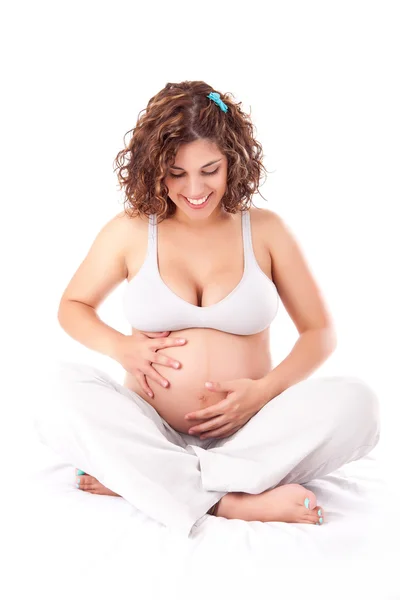 Mooie zwangere vrouw toont haar goede vorm — Stockfoto