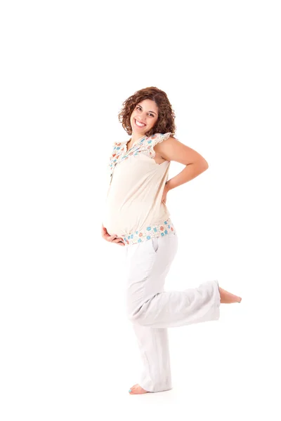 Beautiful pregnant woman showing her good shape — Stock Photo, Image