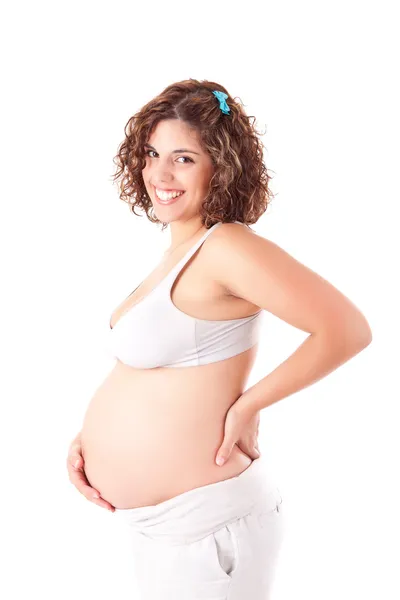 Beautiful pregnant woman showing her good shape Stock Image