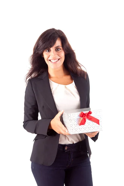 Business woman holding a present on white background — Stok fotoğraf