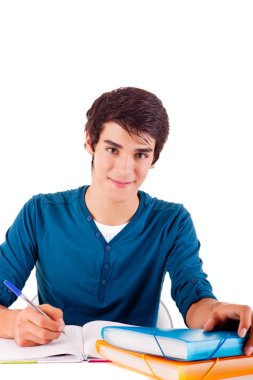 Genç mutlu öğrenci kitap taşıyor.