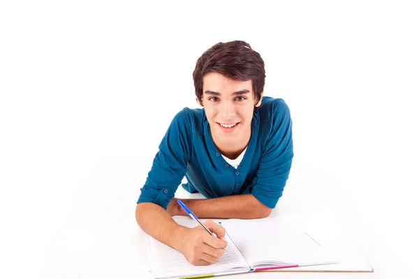 Jovem estudante feliz carregando livros — Fotografia de Stock