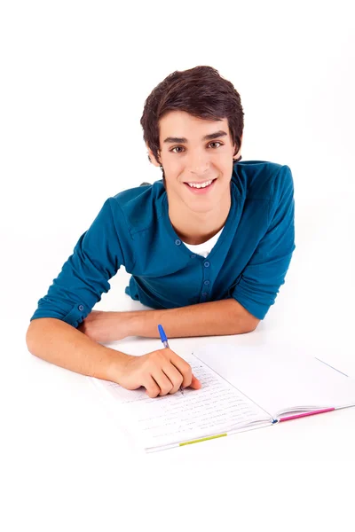 Jovem estudante feliz carregando livros — Fotografia de Stock