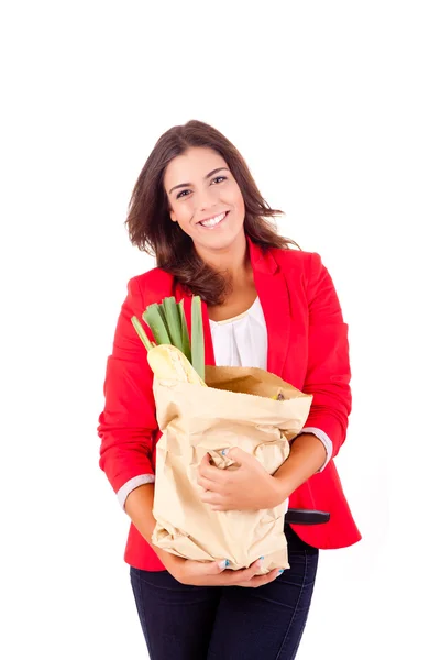 Giovane femmina in possesso di una borsa della spesa su sfondo bianco — Foto Stock