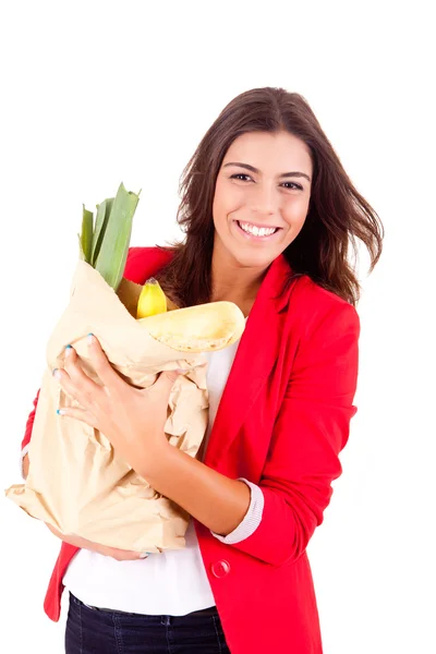 Young female holding a shopping bag on white background — Stock Photo, Image