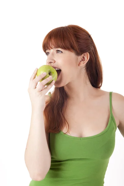 Beautiful young woman eating apple — Stock Photo, Image