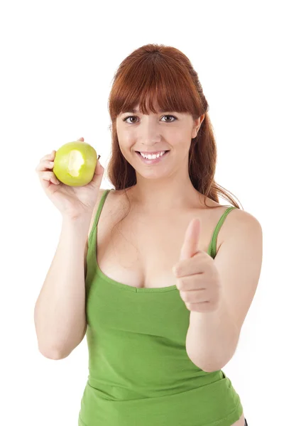 Beautiful young woman eating apple — Stock Photo, Image