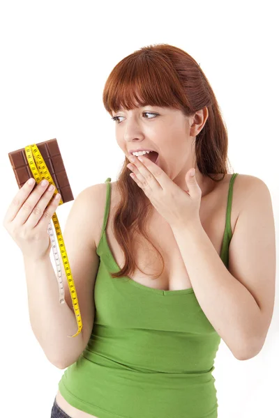 Beautiful young woman holding chocolate — Stock Photo, Image