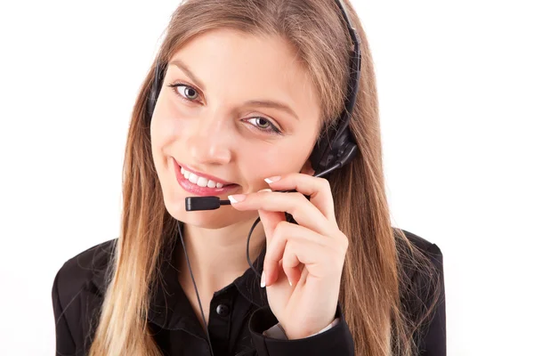 Bella dipendente call center sorridente con un auricolare sopra bianco — Foto Stock