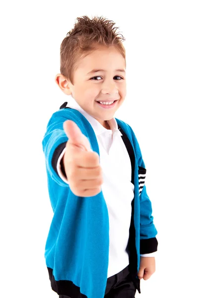 Adorable niño haciendo pulgares hacia arriba sobre fondo blanco — Foto de Stock