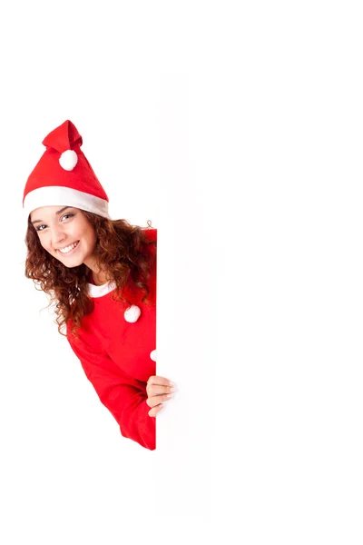 Schöne Weihnachtsfrau lehnt sich an leeres Schild — Stockfoto