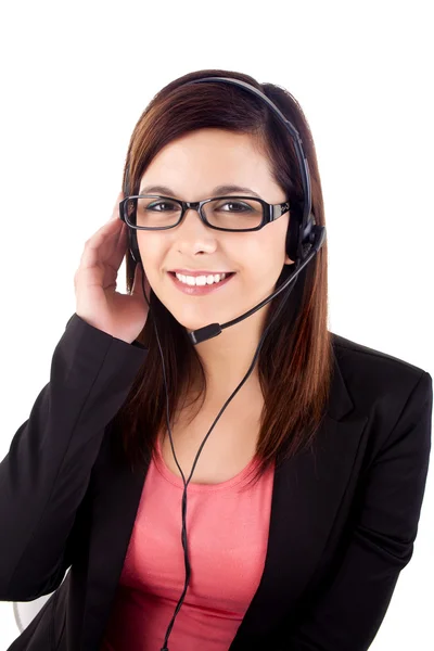 Portrait of a happy young call centre employee smiling with a he Stock Picture