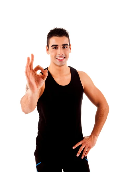 Beautiful fitness instructor doing ok sign — Stock Photo, Image