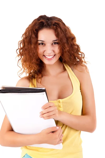 Chica universitaria sosteniendo libros y sonriendo — Foto de Stock