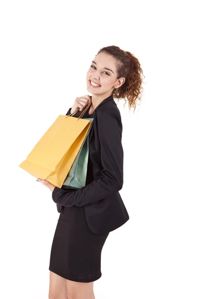 Mujer encantadora con bolsas de compras sobre blanco —  Fotos de Stock