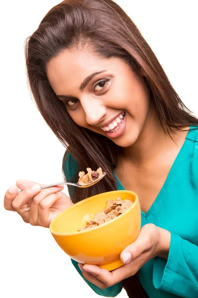 Beautiful mix race woman eating cereals — Stock Photo, Image