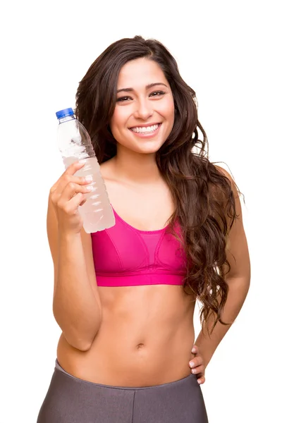 Γυμναστήριο ελκυστική γυναίκα, κρατώντας ένα μπουκάλι νερό — Φωτογραφία Αρχείου