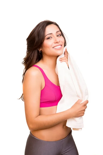 Attractive fitness woman posing with gym towel — Stock Photo, Image