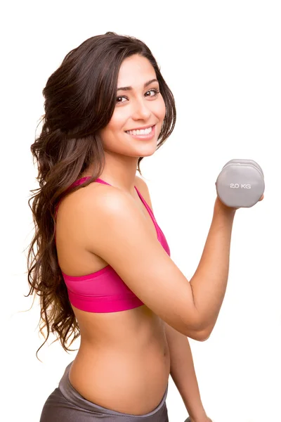 Attractive fitness woman lifting weights Stock Image