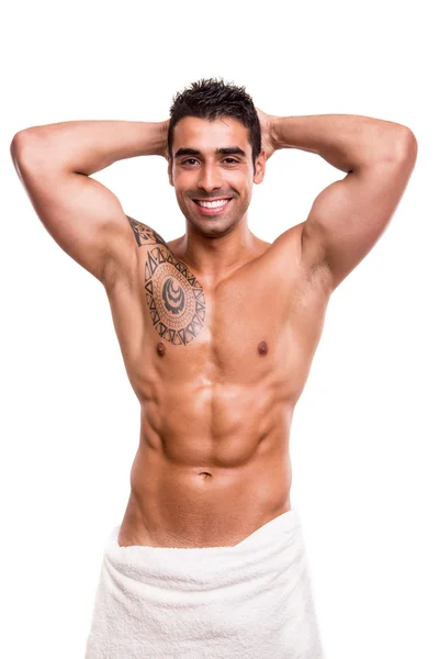 Attractive man posing with a white towel — Stock Photo, Image