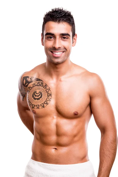 Attractive man posing with a white towel — Stock Photo, Image