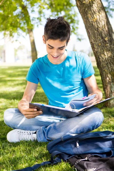 Young student studying at the school garden — Stock Photo, Image