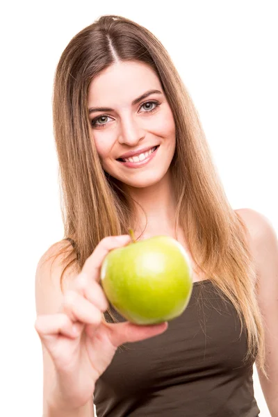 Portret van een jonge vrouw eten van groene appel Stockfoto