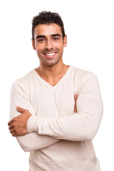 Casual young man with arms crossed and smiling Stock Picture