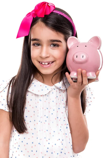 Meisje holding een varkentje bank — Stockfoto