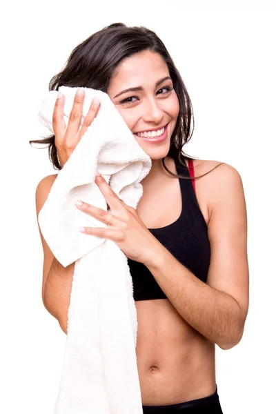 Woman wiping sweat with towel — Stock Photo, Image