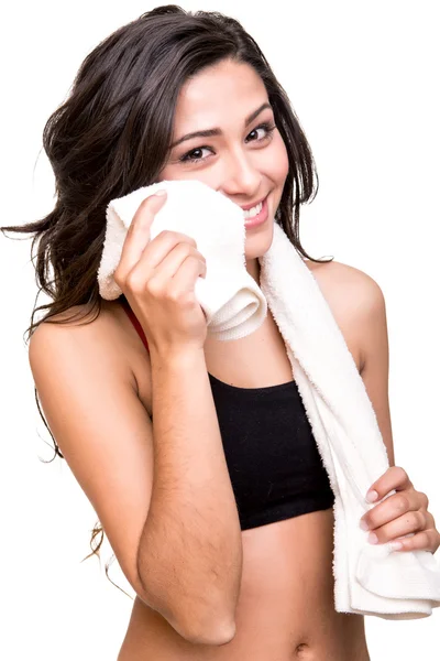 Woman wiping sweat with towel Stock Picture