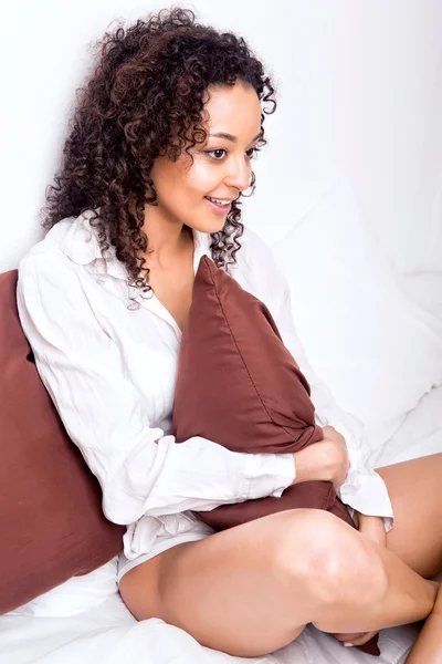 Afro woman relaxing in bed — Stock Photo, Image