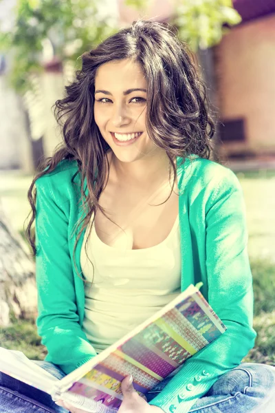 Young student studying at the school garden — Stock Photo, Image