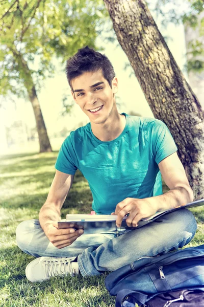 Young student studying at the school garden — Stock Photo, Image