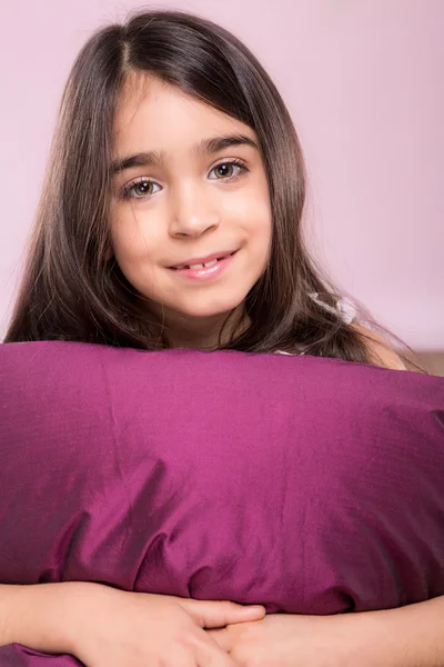 Little girl woke up in white bed — Stock Photo, Image