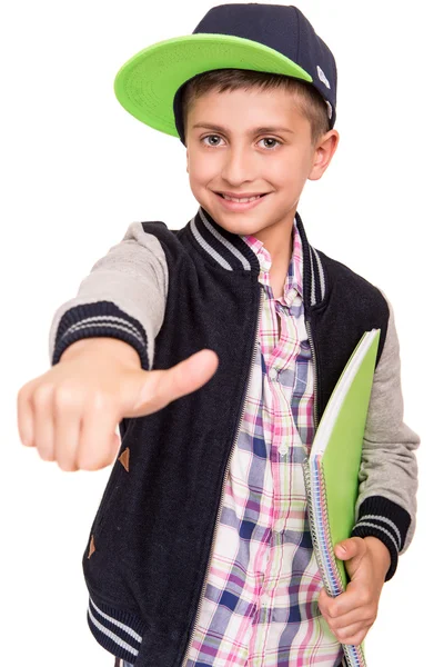 Pequeño estudiante sosteniendo libros — Foto de Stock