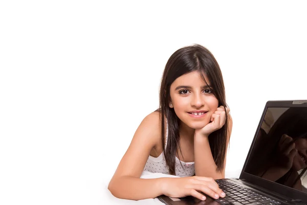 Girl with laptop on bed — Stock Photo, Image