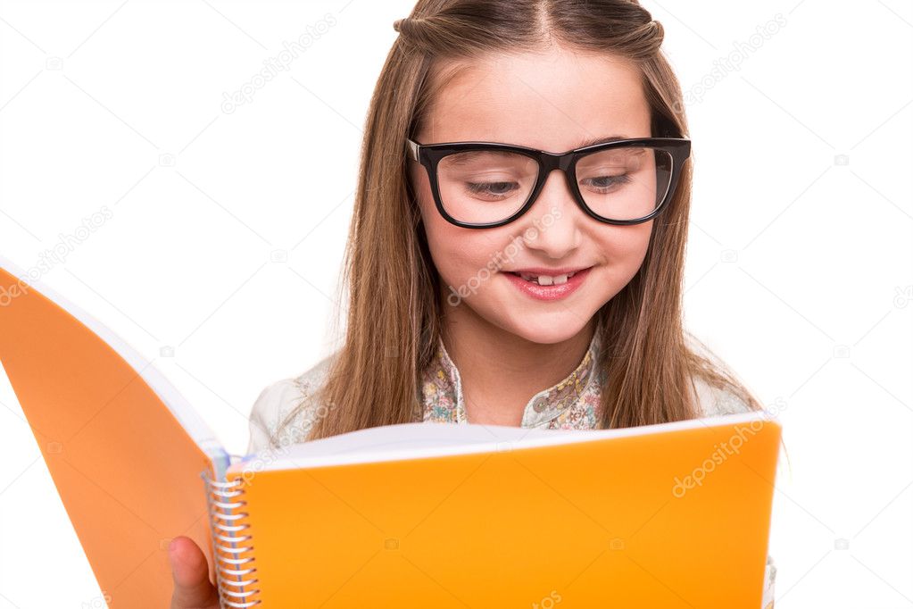 Girl golding a sketchbook